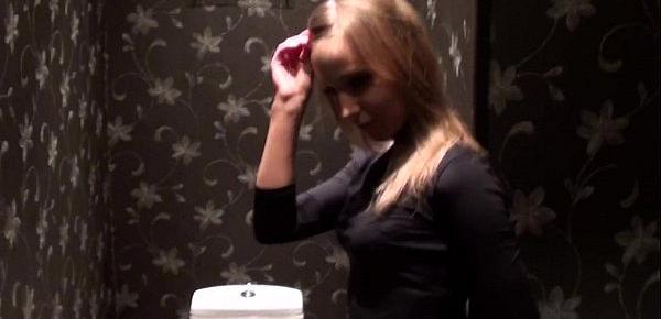  slim blonde shows striptease in the toilet